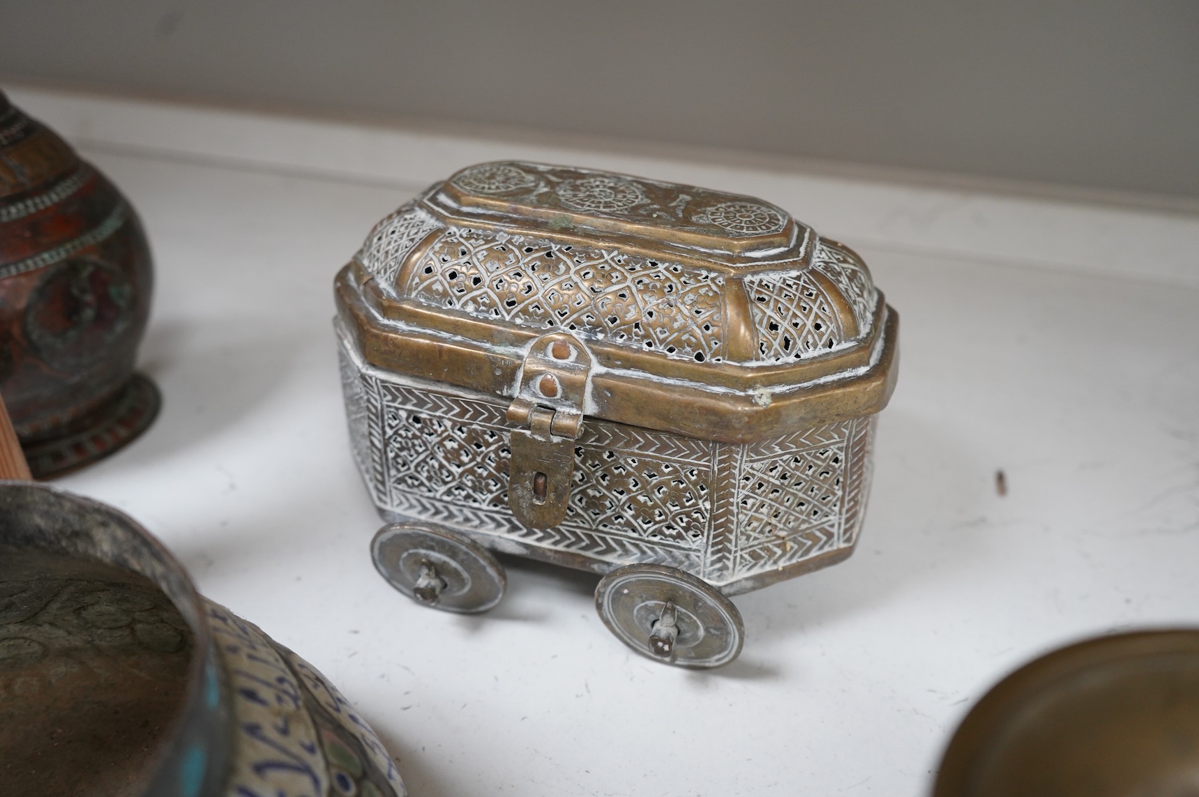 A collection of Persian, Eastern and Chinese metalware to include two brass tripod censers, pair of vases and an enamel bowl, largest 33cm high